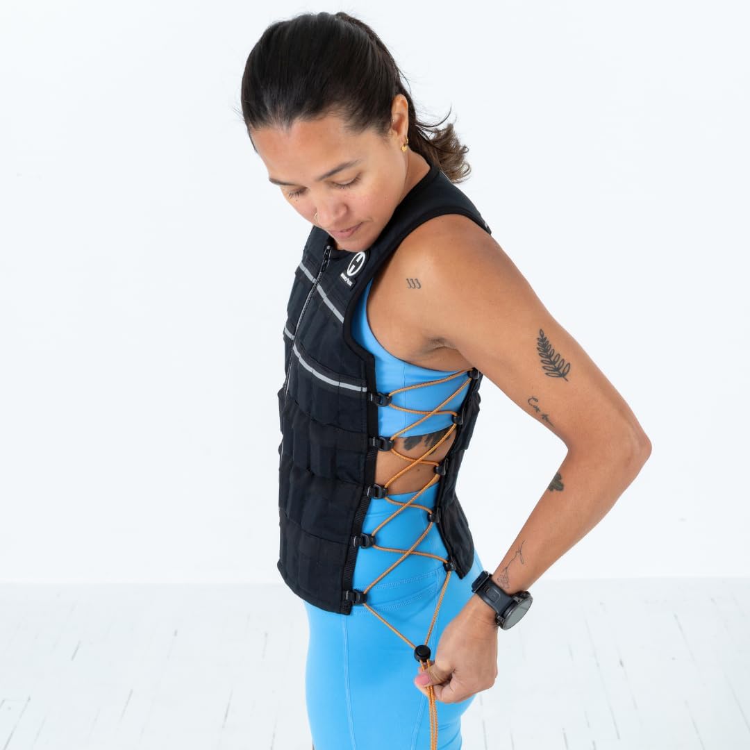 Wearer pulls an orange adjustment cord on a black HyperVest ELITE with crisscrossed side lacing